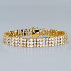 Brand New Women's Gold Triple Row Diamond Tennis Bracelet Available Sizes: 6" 6.5" 7" (The Most Common Women's Size) 7.5" 8" Width 9mm 14k Gold Plated Sterling Silver Genuine 2ct Lab Created Radiant Cut Diamonds Retail Price $550 Buy With Confidence From A Top Rated Seller With A 99%+ Feedback Rating! A1300 (Id-1515) Elegant Iced Out Sterling Silver Bracelet, Classic Iced Out Tennis Bracelet For Anniversary, Classic Iced Out Diamond Bracelet, Yellow Gold Multi-stone Tennis Bracelet As Gift, 14k Gold Diamond Bracelet, Tarnish Resistant, Luxury Gold Multi-stone Tennis Bracelet, Dazzling Brilliant-cut Yellow Gold Bracelet, Gold Flower Bracelet, Yellow Gold Diamond Bracelets, Tarnish Resistant