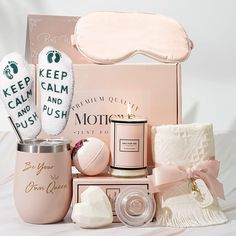 a pink gift box filled with personal care items and a sleeping mask on top of it