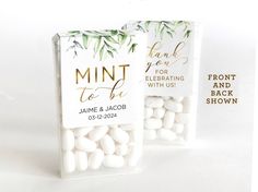 two clear bags filled with white chocolate covered marshmallows next to each other