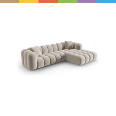 a large sectional couch sitting on top of a white floor next to a rainbow colored wall