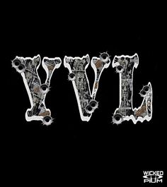 the letters vvl are made out of metal