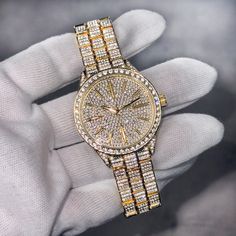 Step into elegance with this iced-out diamond timepiece that mirrors genuine luxury watches. We utilize premium simulated diamonds crafted from high-refractive crystals, ensuring a sparkle that rivals authentic diamonds under the light! INCLUDES AN EASY-TO-USE SIZE ADJUSTMENT TOOL Specifications: - Gender: Women's - Case Size: 39mm - Movement: Quartz Movement - Battery: Included - Sizing: 9-inch band - Adjustable: Links are removable to fit your wrist - Back: Stainless Steel - Lock: Fold Over Clasp - Stone: VVS Diamond Simulate - Case Material: Alloy - Finish: Gold Plating  Whether you're dressing up for casual days, or events, or gifting someone special on occasions like Graduations, Valentine's Day, Anniversaries, Birthdays, Thanksgiving, Christmas, New Year, or Father's Day, this watch Stainless Steel Diamond Watch With Diamond Hour Markers, Silver Diamond Watch With Rhinestones And Crystal, Luxury Diamond Watch With Rhinestones And Crystal, Luxury Crystal Diamond Watch With Rhinestones, Round Diamond Watch With Bling, Diamond Bling Watch, Luxury Crystal Watch With Rhinestones, Luxury Diamond Watch With Rhinestones, Luxury Round Diamond Watch With Rhinestones