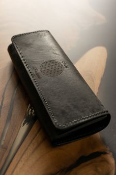 Elevate your style with our exquisite handcrafted black women's wallet. Meticulously crafted from premium black leather, this wallet combines sophistication with functionality. This accessory is designed for those who appreciate both quality and aesthetics. Product Details: Material: Crafted from premium black leather for durability and an elegant, timeless look. 🚩 Personalization: Add a name engraving to the wallet or a special phrase that will make your gift even more unique. Handwork: Each w Black Rectangular Wallet As Gift, Classic Handmade Travel Wallet, Black Leather Wallet As Gift, Luxury Black Trifold Wallet, Leather Rectangular Wallet, Classic Black Trifold Wallet As Gift, Elegant Black Trifold Wallet With Smooth Grain, Black Wallet With Card Slots, Leather Wallets With Rectangular Case For Gift