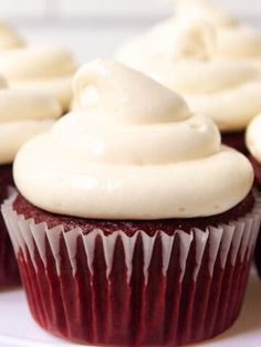 cupcakes with white frosting on a plate