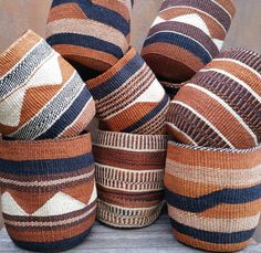 several woven baskets stacked on top of each other