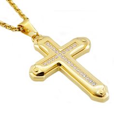 A sparkling display of your faith, this beautiful cubic zirconia cross pendant shines brightly. Crafted in gold plated stainless steel with small round shimmering cubic zirconia. Its perfect piece for daily wear or special occasions. This pendant suspends freely along an chain that secures with a lobster clasp. Inspirational in every way, this beautifully two layered stainless steel cross pendant features a combined two layers of crosses. Faith and fashion meet in this small round dazzling cubic Cubic Zirconia Cross Necklace With Diamond Accents, Gold Cross Pendant Necklace With Bling, Cubic Zirconia Crucifix Cross Necklace With Diamond Accents, Gold Bling Cross Pendant Necklace, Gold Cubic Zirconia Cross Necklace, Crucifix Cross Necklace With Diamond Accents In Cubic Zirconia, Yellow Gold Cubic Zirconia Cross Necklace, Gold Stainless Steel Cross Pendant Necklace, Gold Crucifix Cross Necklace With Diamond Accents