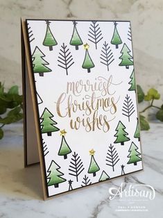 a christmas card with trees on it and the words merry christmas wishes written in gold