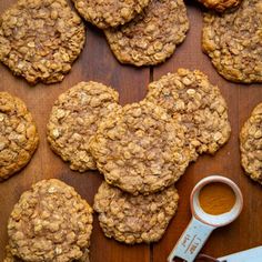 several cookies are arranged on a wooden table