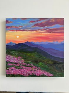 a painting of flowers in the foreground with mountains in the background at sunset,