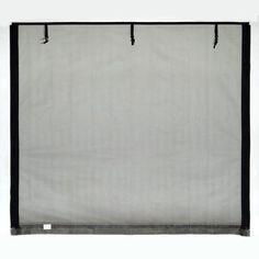 a white and black curtain hanging on a wall