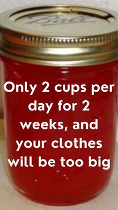 a red mason jar with the words only 2 cups per day for 2 weeks and your clothes will be too big