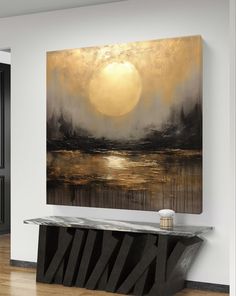 an abstract painting hangs on the wall above a console table