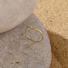 Let The Wishbone Stacking Ring to bring luck to your life. Crafted in 14k solid gold to be the perfect gift for special occasions. It is convenient to be worn alone or stacked. - Made in 14k solid gold - Band Width: 1.20 mm / 0.047 inches - Thickness: 1.20 mm / 0.047 inches -This product comes with iconic Norm Jewels gift box Solid Gold Band, Rings Simple, Stacking Ring, Stacking Rings, Gold Bands, Heart Ring, Solid Gold, Wedding Bands, Gift Box