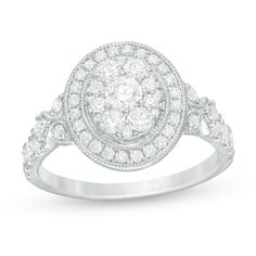 a white gold ring with diamonds in the center and an oval design around it, on top of a white background