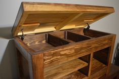 an open wooden box sitting on top of a table