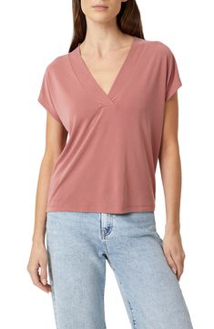 This nicely draped V-neck top is made from supersoft, fluid knit fabric with dropped shoulders to further the casual-chic look. 23 1/2" length (size Small) V-neck Short sleeves 78% modal, 22% polyester Machine wash, dry flat Made in Turkey Versatile Solid Color V-neck Top, Casual V-neck Top In Viscose For Summer, Casual Viscose V-neck Top For Summer, Casual Viscose V-neck Top For Spring, Casual V-neck Viscose Top For Spring, Relaxed Fit Rayon V-neck Top, Relaxed Fit V-neck Rayon Top, Versatile Pink V-neck Top, Chic Modal V-neck Tops