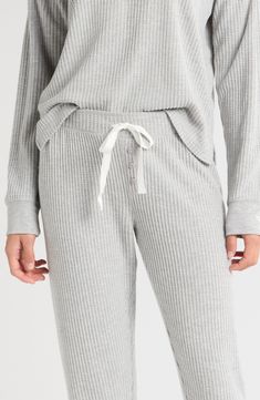 Lounge around or slumber in the unparalleled coziness of these waffle-knit pajamas featuring comfy joggers and a matching henley top detailed with a cross-stitched star at the cuff. 23" top length; 29" inseam; 8 1/2" leg opening; 10" front rise; 14" back rise Top has button half placket; crewneck; long sleeves; side slits Pants have elastic/drawstring waist 62% polyester, 33% rayon, 5% elastane Machine wash, tumble dry Imported Knit Pajamas, Thermal Pajamas, Henley Top, Free Fabric, Waffle Knit, Drawstring Waist, Pajama Set, Skiing, Pajamas