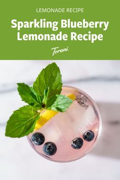 sparkling blueberry lemonade recipe in a glass with mint garnish on top