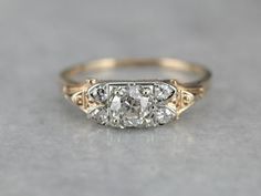 an antique three stone diamond ring