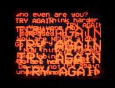 an orange and black screen with words written in different languages on it's side