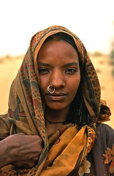 a woman with a nose piercing in the desert