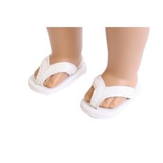 a doll's feet wearing white slippers