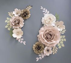 paper flowers are arranged on the wall in order to make it look like they have been cut