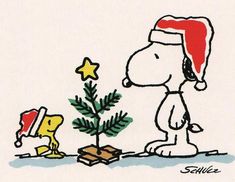 a charlie brown christmas card with a dog and a tree on the ground next to it