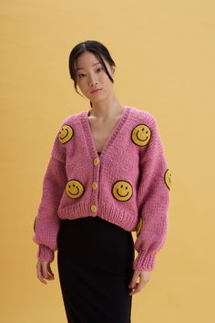 The 2D Smiley Pink Cardigan for women with soft 100% mix premium wools. It is very stylish, chunky, and warm. *The model is wearing a small size *Our cardigan comes without buttons. If you would like to add buttons please use our personalization box while ordering. *It is a unique piece that you can keep in your wardrobe for a lifetime. *Used soft mix wool *100% handmade  It is handcrafted by Gülçin, one of the precious members of our team. We believe in empowering women in all areas in todays' Hand Knitted Cardigan For Fall, Trendy Hand Knitted Outerwear For Fall, Trendy Winter Hand Knitted Outerwear, Trendy Hand Knitted Winter Outerwear, Trendy Hand Knitted Outerwear For Winter, Trendy Wool Cardigan, Trendy Hand Knitted Sweater For Winter, Trendy Hand Knitted Winter Sweater, Pink Cardigan