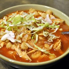 a bowl of soup with meat and vegetables