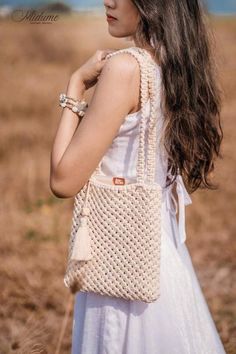 It doesn't have to be fancy or flashy. You just need to choose simple and gentle accessories that also make you stand out in the crowd. The hand-tied Macrame bag from ivory white cotton cord is a multi-style bag perfect for a clown beach accessory.  If it is paired with a maxi skirt, it's great. 🎗HANDMADE MACRAME SHEET BAGS🎗 Size: 49*24cm  ▶ Extremely delicate design style Boho Chic, Bohemian, Vintage. The product is very popular in Europe.  ▶ Women's armpit bag is convenient when going out, t Handmade Cream Crossbody Bag, Chic Handmade Cream Crossbody Bag, Chic Handmade Cream Shoulder Bag, Cream Crochet Pouch Bag With Adjustable Strap, White Shoulder Bag With Long Strap For Everyday, Bohemian Rectangular Bag With Long Strap, Handmade Beige Crossbody Shoulder Bag, Cream Crossbody Crochet Bag For Daily Use, Cream Crochet Crossbody Bag For Daily Use