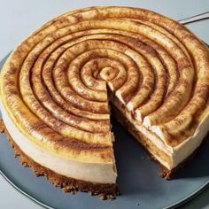 a cheesecake is cut in half on a plate