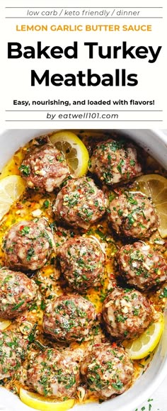 baked turkey meatballs in a white bowl with lemons and parsley