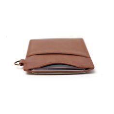 Our Vertical Wallet is a stylish and slim leather wallet, featuring a signature elastic pocket that securely holds cards while adding a unique touch of style. It's patented design allows you to carry your cards with ease and comfort. Get the sleek and slim Vertical Wallet to stay organized and stylish.