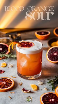 blood orange sour cocktail garnished with rosemary and dried cranberries on a table