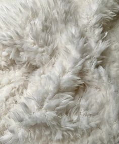 Natural off-white faux fur fabric, crafted to the highest standards of luxury and quality. With its super-soft texture and generous 1-inch pile, this fabric adds a touch of opulence to any project. Perfect for pillow decor or as a delightful photo prop for babies. Fur fabrics naturally shed hairs when cut, resulting in fluff falling off. To prevent this loss, simply overlock the raw edges to secure the material during construction. PRODUCT DETAILS 100% poly/cotton Slight stretch Medium heavy wei Cozy White Fur Coat With Faux Fur Lining, Animal Fur, Pillow Decor, Mini Craft, Fur Fabric, Faux Fur Fabric, Fur Fabrics, White Faux Fur, Soft Texture