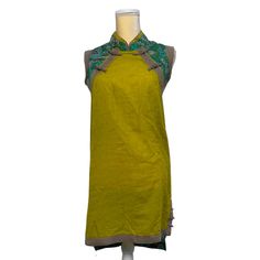 Artka Chinese-Styled Sleeveless Tunic Mini Dress Qipao Size Small - Nwot Like New Condition With No Defects High-Low Above The Knee Length Mustard Yellow Front And Green Printed Fabric In The Back Side Buttons On Hem Of Both Sides Hidden Half Zipper In Back Wear Alone As A Mini Or Over Leggings Or As A Top With Skirt And You'll Have A Very Special Outfit For A Day Out Front 100% Cotton Back 65% Polyester 35%Cotton Approximate Measurements Shoulders 15” Pit-To-Pit 16” Waist 17.5" Length Front 32. Traditional Green Sleeveless Dress, Fitted Sleeveless Summer Cheongsam, Traditional Fitted Sleeveless Cheongsam, Top With Skirt, Sleeveless Tunic, Printed Fabric, Above The Knee, Mustard Yellow, Chinese Style