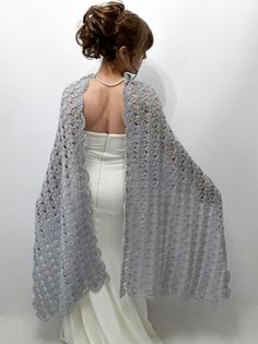 Gray Shawl İf you purchase 3 or more items please use ''BONUS'' as Coupon Code for 10% discount during the check out. MATERİAL: Mohair, wool, silver glitter, acrylic. COLOR: Gray with silver glitter as shown AVAİLABLE COLORS: White, cream, light gray, gray with glitter, dark gray, rose, burgundy, royal (cobalt) blue, navy blue, light beige, red, brown, mustard, pink, black. MEASUREMENTS: Approximately 21 inches wide (55 cm) / 71 inches long ( 180 cm ) CARE INSTRUCTIONS: - Wash at low temperature Elegant Silver Shawl For Evening, Elegant Silver Shawl For Formal Occasions, Silver Formal Shawl, Elegant Handmade Shawl For Wedding, Elegant Crochet Shawl For Wedding, Elegant Lace Crochet Shawl, Wedding Crochet Lace Shawl, Wedding Lace Crochet Shawl, Silver Wedding Shawl