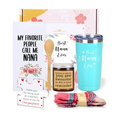 the mother's day gift set includes a blue tumbler, greeting cards and a wooden spoon