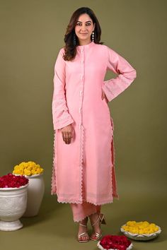 Pink kurta with placement lace detailing and beaded fringe buttons. Paired with a matching plain pant with lace detail on hem. - Aza Fashions Traditional Palazzo Set With Lace Work, Fitted Cotton Traditional Wear With Lace Work, Festive Lace Work Palazzo Set, Designer Lace Work Kurta, Traditional Spring Sets With Lace Trim, Traditional Lace Trim Set For Spring, Festive Cotton Sets With Lace Trim, Festive Straight Kurta With Lace Trim, Pink Straight Kurta Set With Lace Work