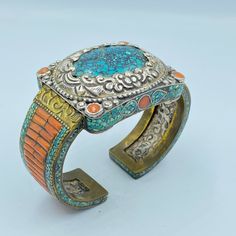 The Beautiful Hand Made Vintage Nepali Tibetan Silver Bracelet Decorated Beautifully With Coral and Turquoise With Unique Historic Patterns Designs . Conditions Of Items Is Clearly Shown In The Pictures Above Fast and Free Shipping World Wide Traditional Blue Bracelets With Natural Stones, Adjustable Multicolor Patina Jewelry, Spiritual Turquoise Cuff Bracelet With Natural Stones, Turquoise Cuff Bracelet With Natural Stones, Traditional Turquoise Bracelets For Festival, Turquoise Bracelet With Patina As A Gift, Blue Patina Bracelet Jewelry, Blue Patina Bracelet, Traditional Turquoise Bangle Bracelet