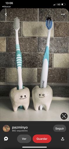 two toothbrushes sitting on top of each other