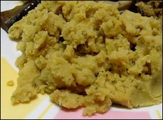 a close up of food on a plate with utensils in the back ground