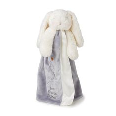 a stuffed bunny in a bag on a white background