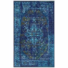 a blue area rug with an ornate design on the front and back side, in various colors