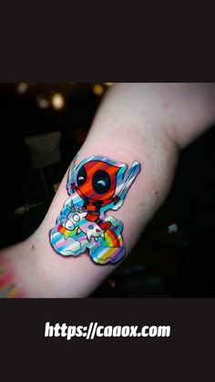 a person with a colorful tattoo on their arm