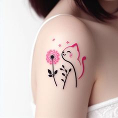 a woman's arm with a cat and flower tattoo on the left side of her shoulder