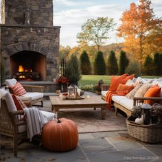 a living room filled with furniture and a fire place in front of a stone fireplace