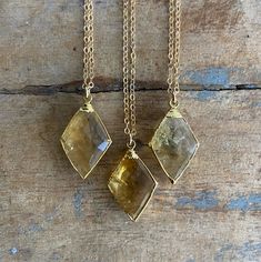 "Beautiful AAA Citrine Diamond Shaped Necklaces. 24k gold plated around the edges of the pendant so you can soak in the citrine energy through your skin✨ Chains are gold fill and a total length of 18\" and can be shortened to 16\" or 17\". Citrine attracts wealth, prosperity and success. It imparts joy, wonder, delight and enthusiasm. Raises self-esteem and self-confidence. Stimulates the brain, strengthening the intellect. Citrine promotes motivation, activates creativity and encourages self-ex Gold Citrine Gemstone Crystal Necklaces, Gold Citrine Gemstone Crystal Necklace, Gold Citrine Necklace For Healing, Gold Citrine Pendant Crystal Necklace, Full Moon Necklace, Gold Moon Necklace, Black Onyx Necklace, Citrine Pendant, Citrine Necklace