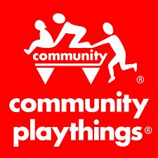 the community playthings logo is shown in white on a red background with two people playing